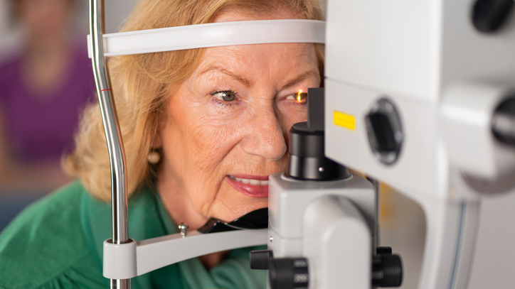 Elderly woman getting eye exam
